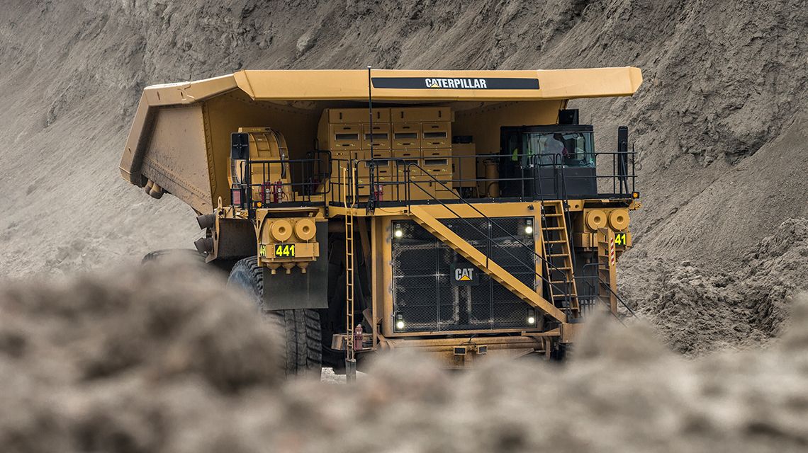 Mining truck driving through mining site
