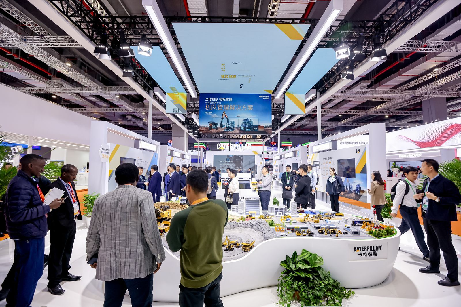 attendees in the Caterpillar booth at CIIE