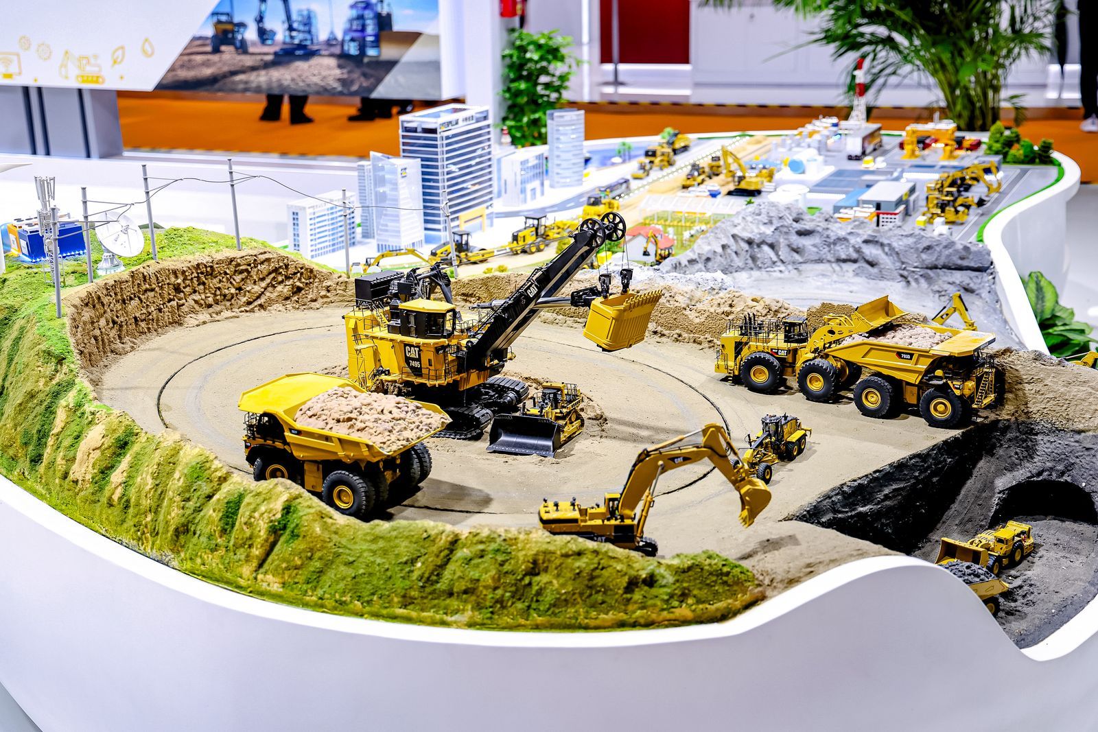 display of miniature Caterpillar machines at the Caterpillar booth