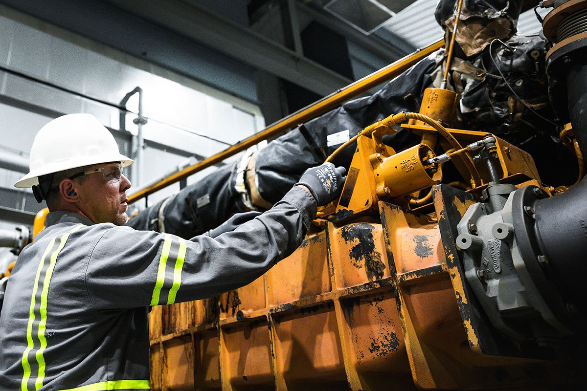 Operator working looking at controls of an engine