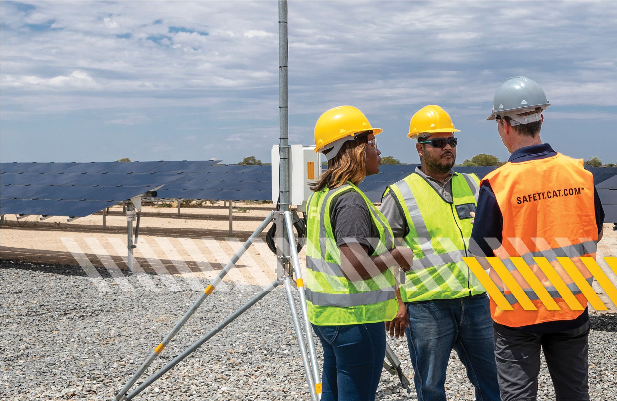 Three people talking on job site