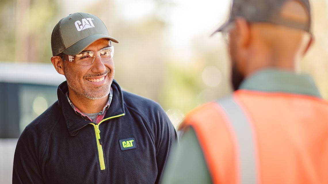 Person smiling while looking at other person