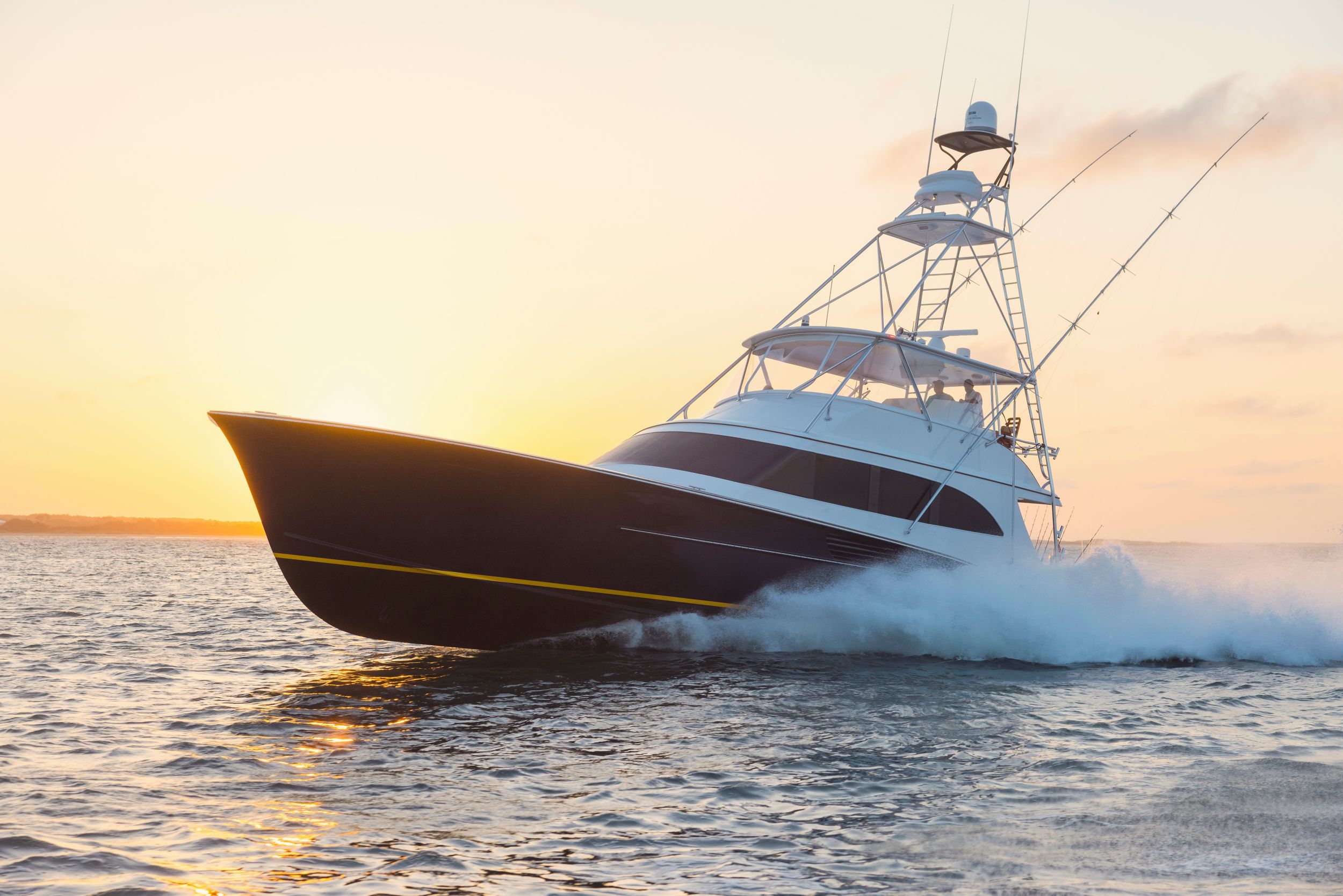 Sunset view of a sportfishing yacht underway