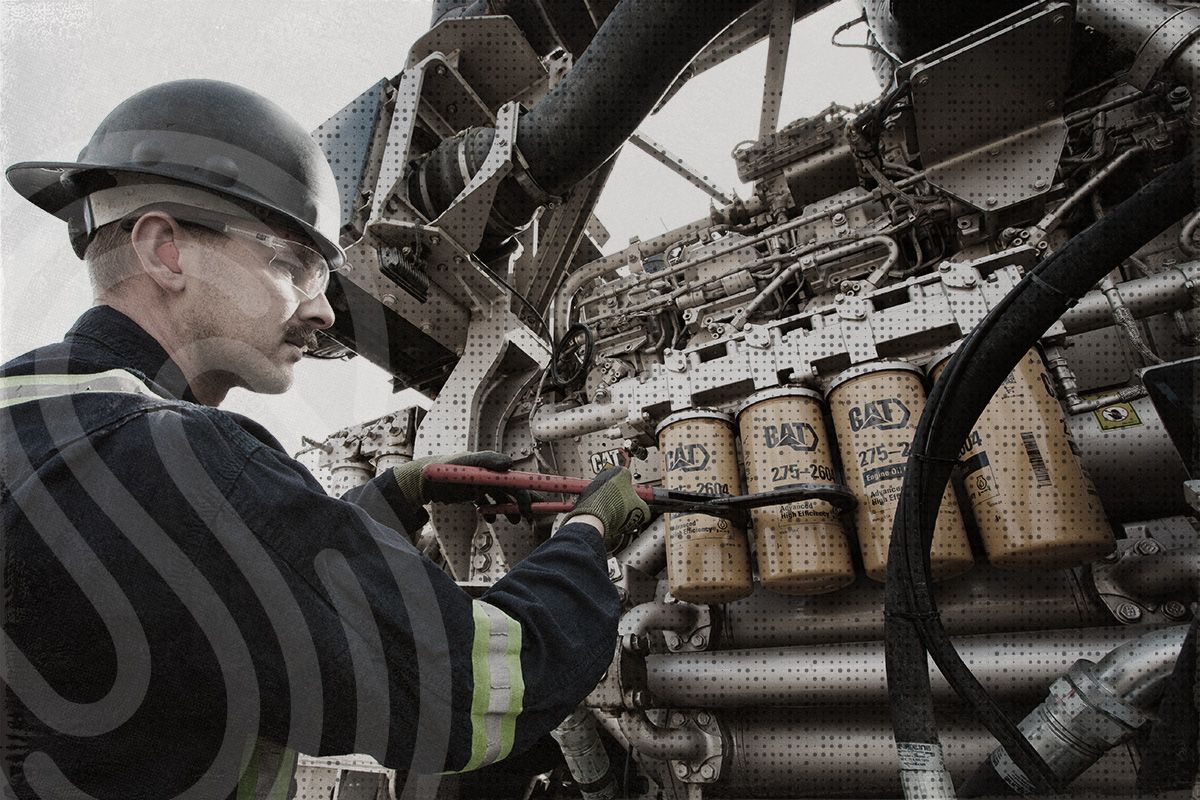 Tech servicing engine in field