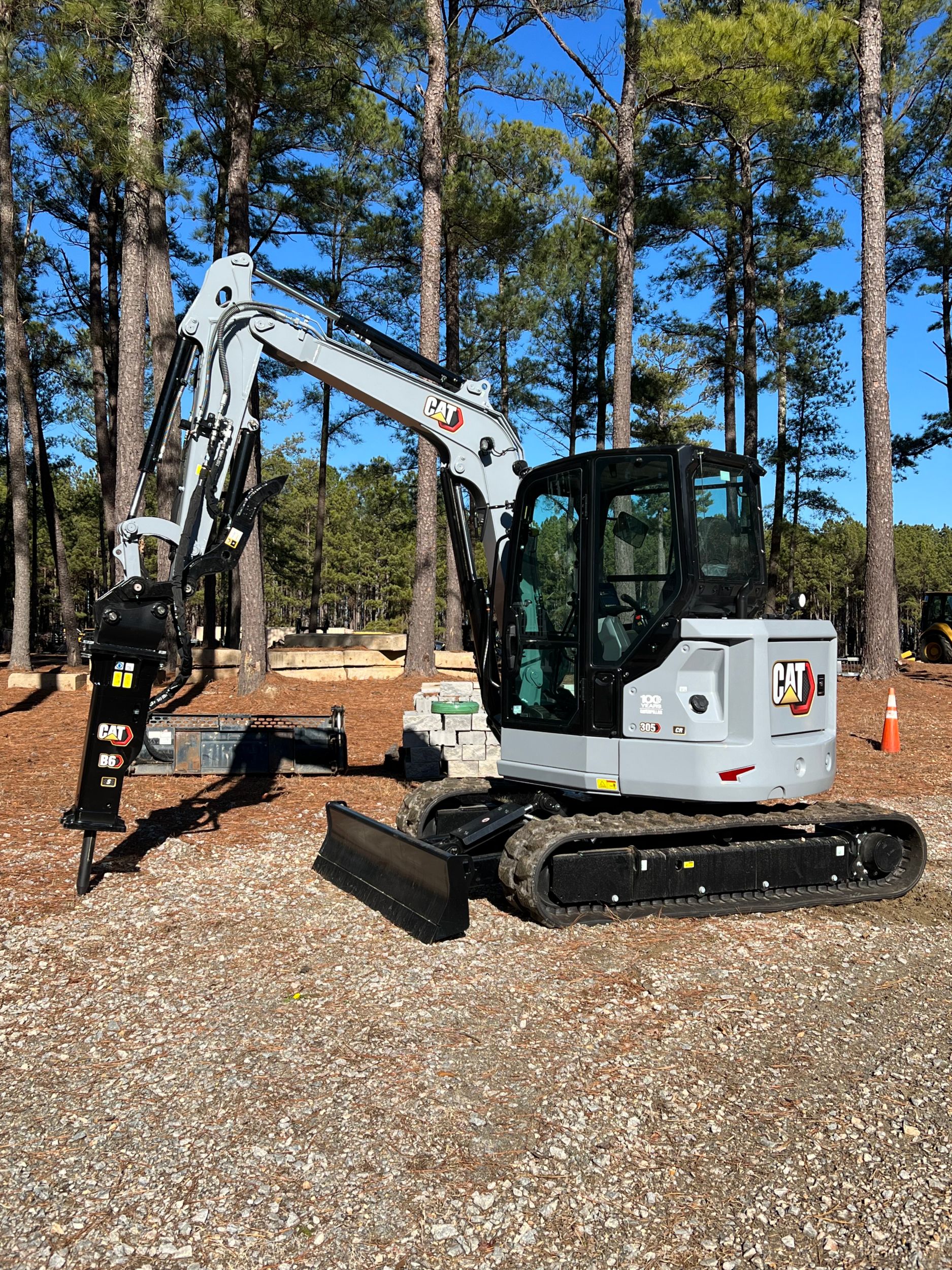Cat 305 Mini Excavator in “Centennial Grey.”