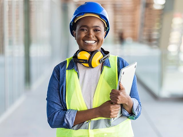 Facility manager, young female Cat construction manager