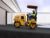 CB2.9 tandem vibratory roller compacting asphalt in a parking lot.