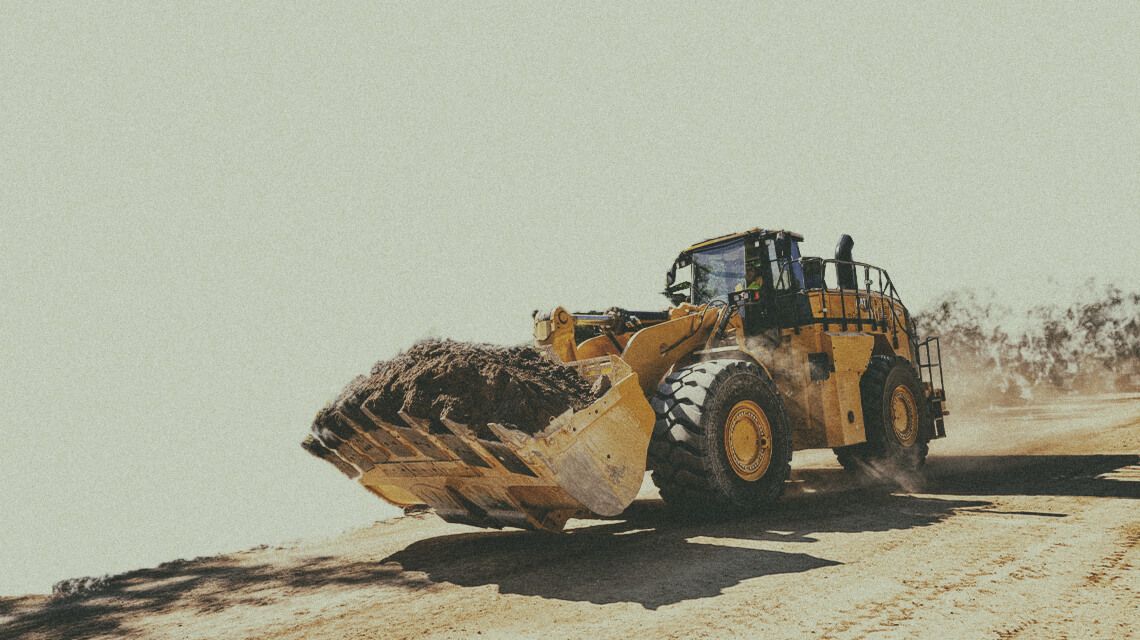 Wheel loader transporting dirt