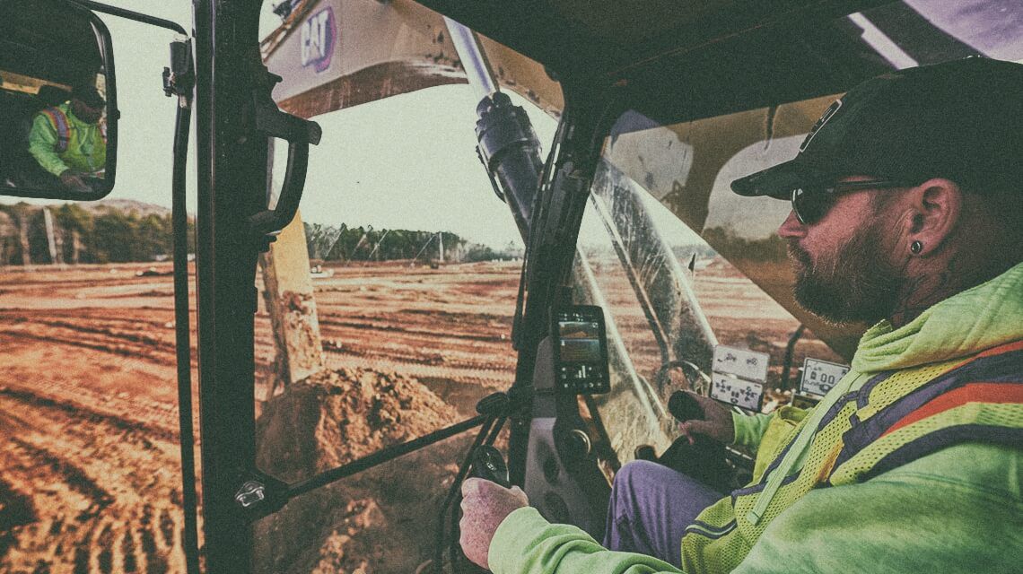 Machine operator in Cat excavator | Assist
