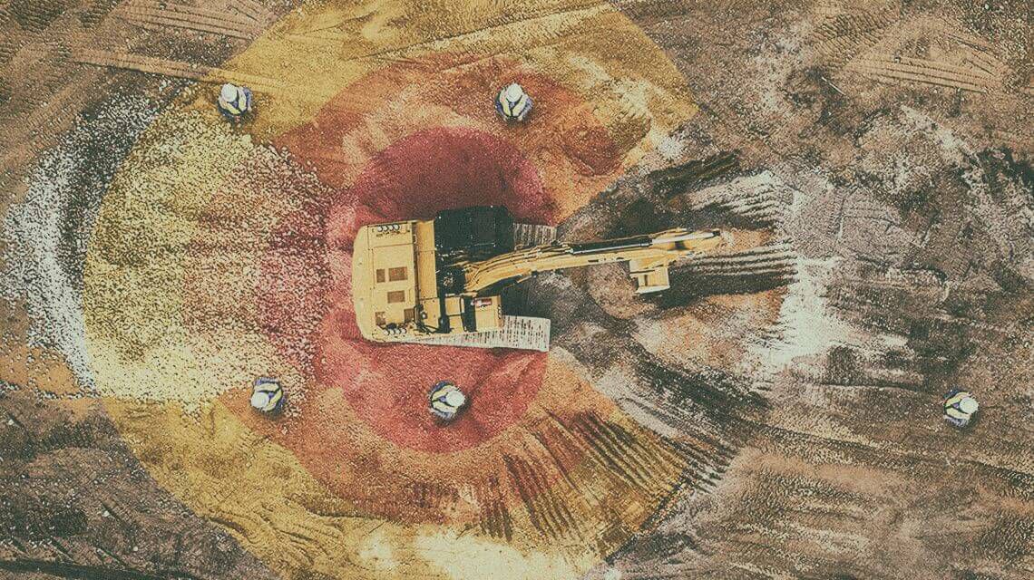 Excavator on jobsite with graphics portraying detect technology | Detect