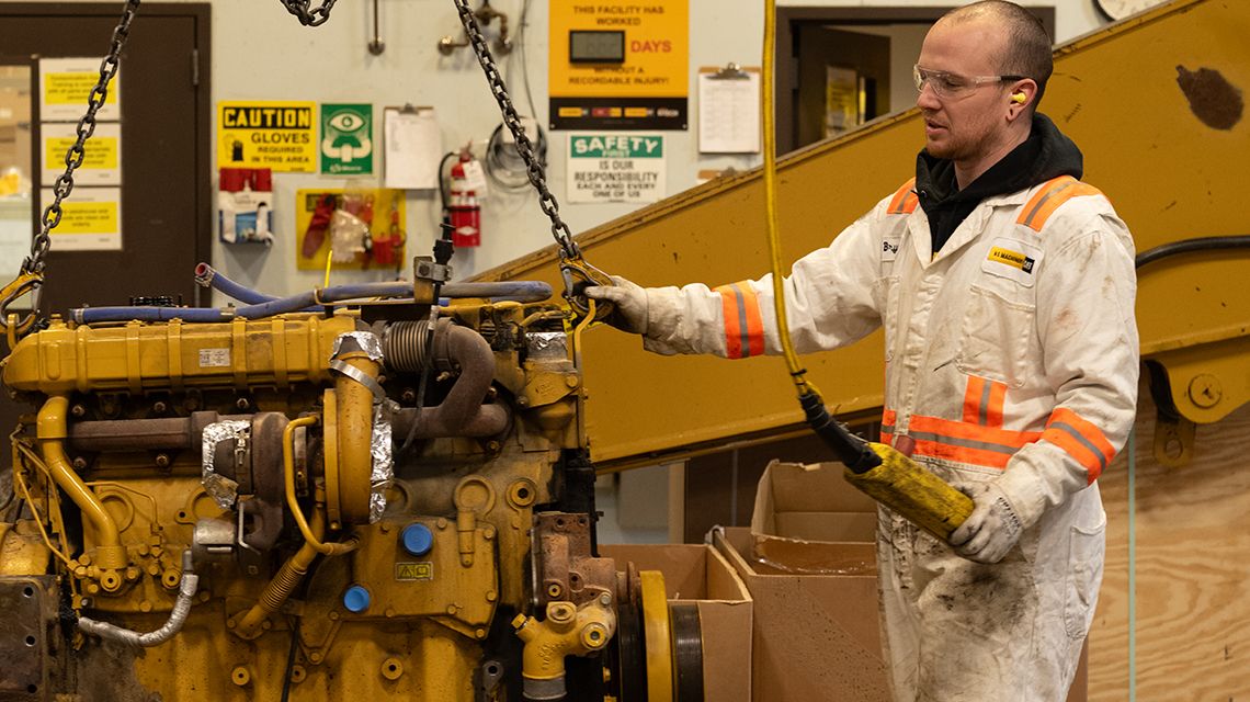 At N C Machinery, level 3 technician Brydon McMillan works on the excavator rebuild.
