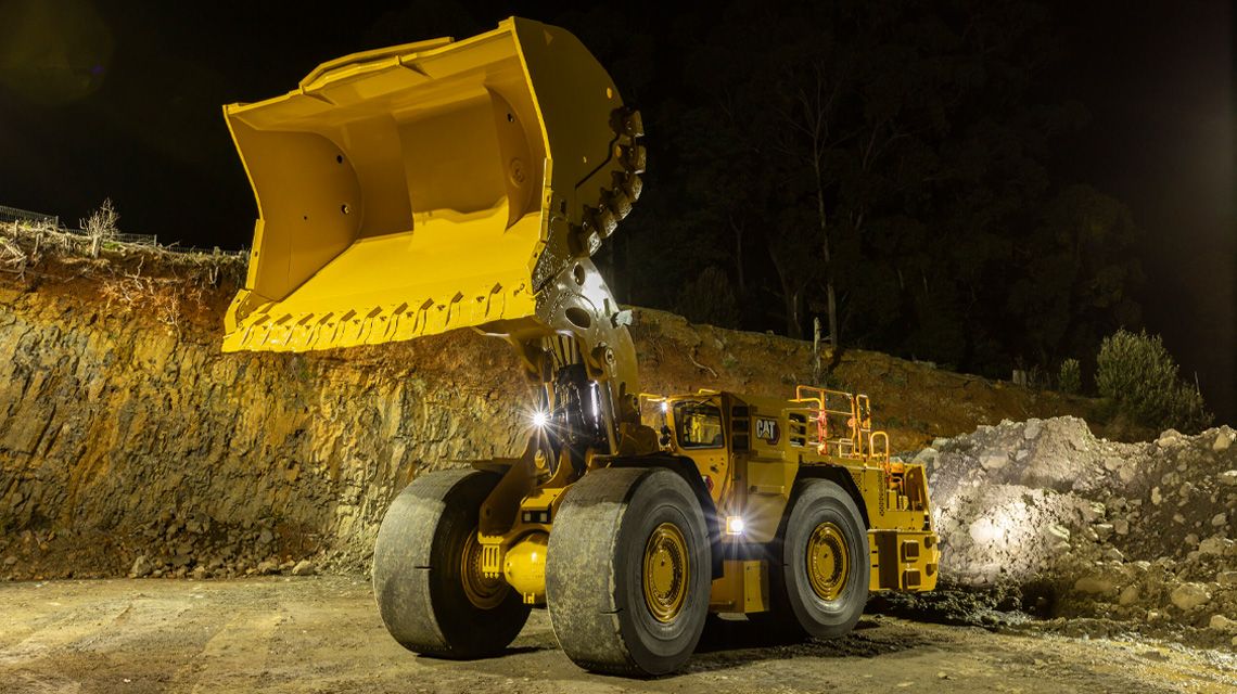Cat Wheel loader holding bucket high in air