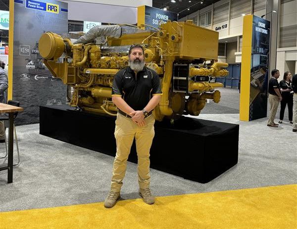 Tim Styfhoorn in front of an engine