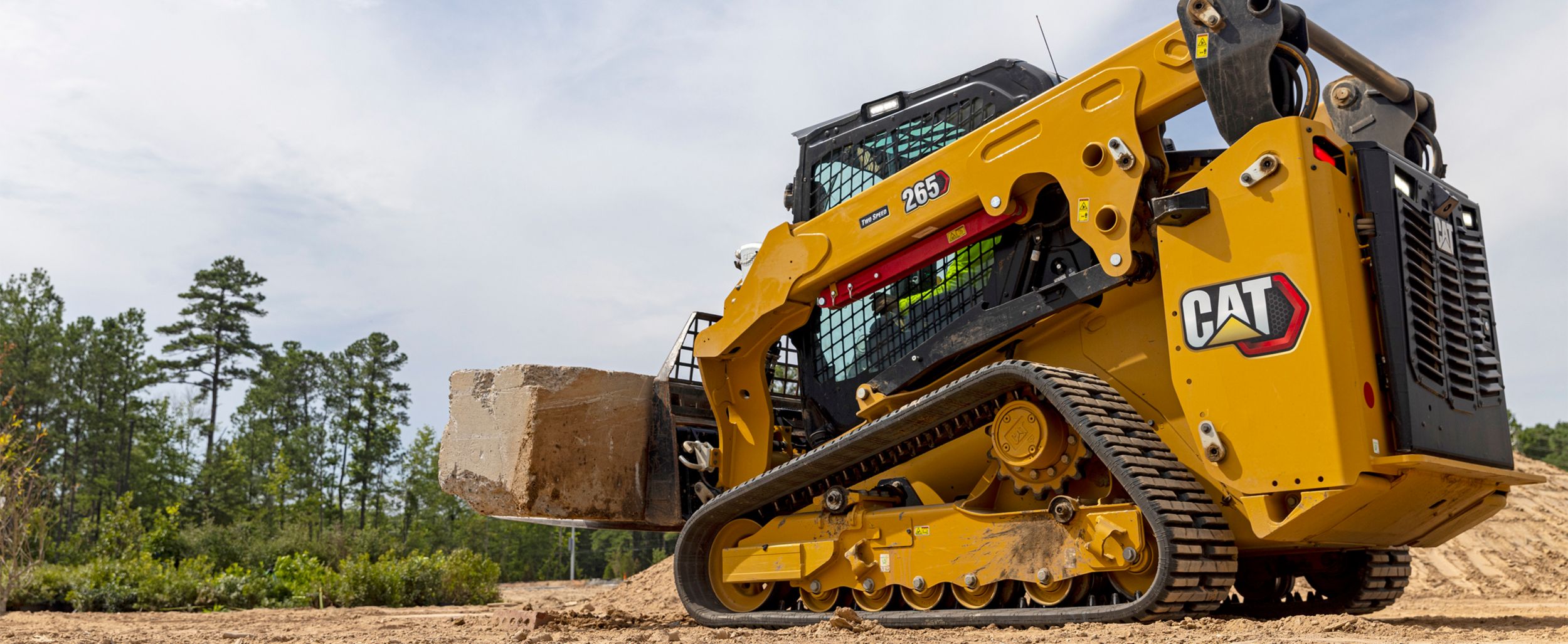 Skid Steer dumping dirt