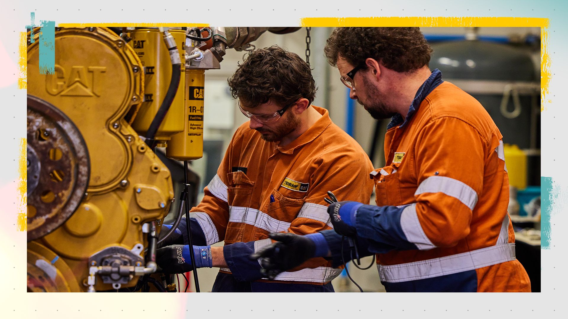 Two technicians working on a Cat engine