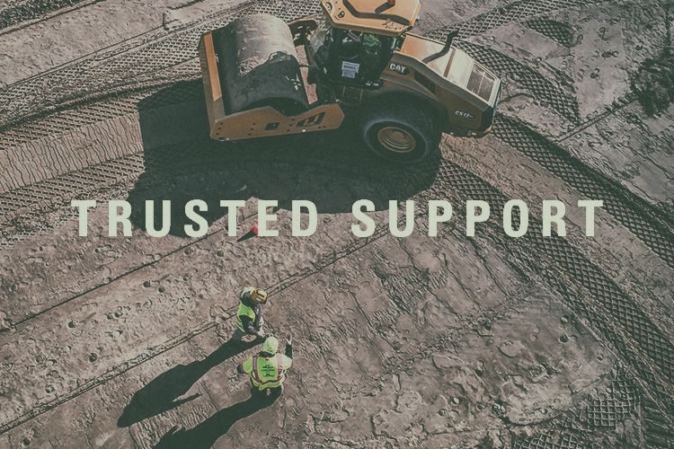 a couple workers discussing their next move with "Trusted Support" embedded in the image