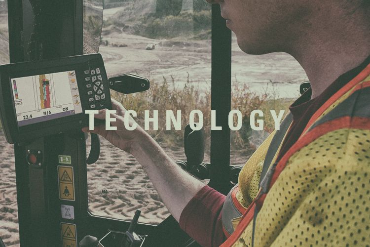 an operator using a console with "Technology" embedded in the image