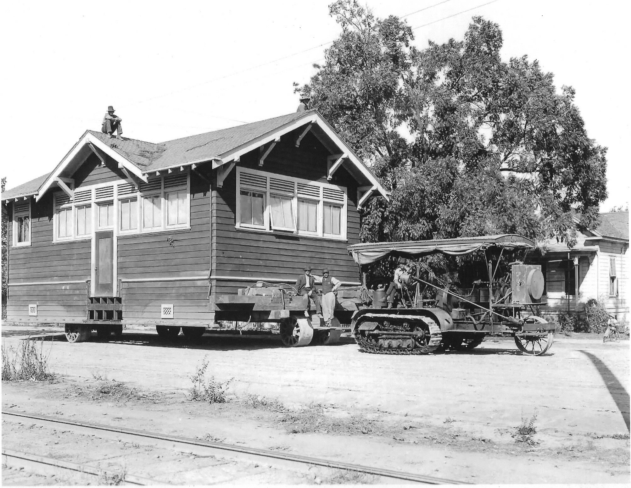 Holt 75 Track-Type Tractor moving a house, ca. 1920.