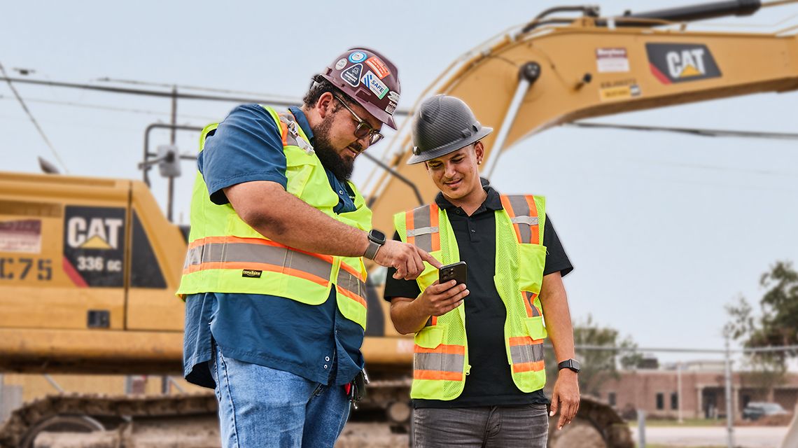 two people looking at a phone