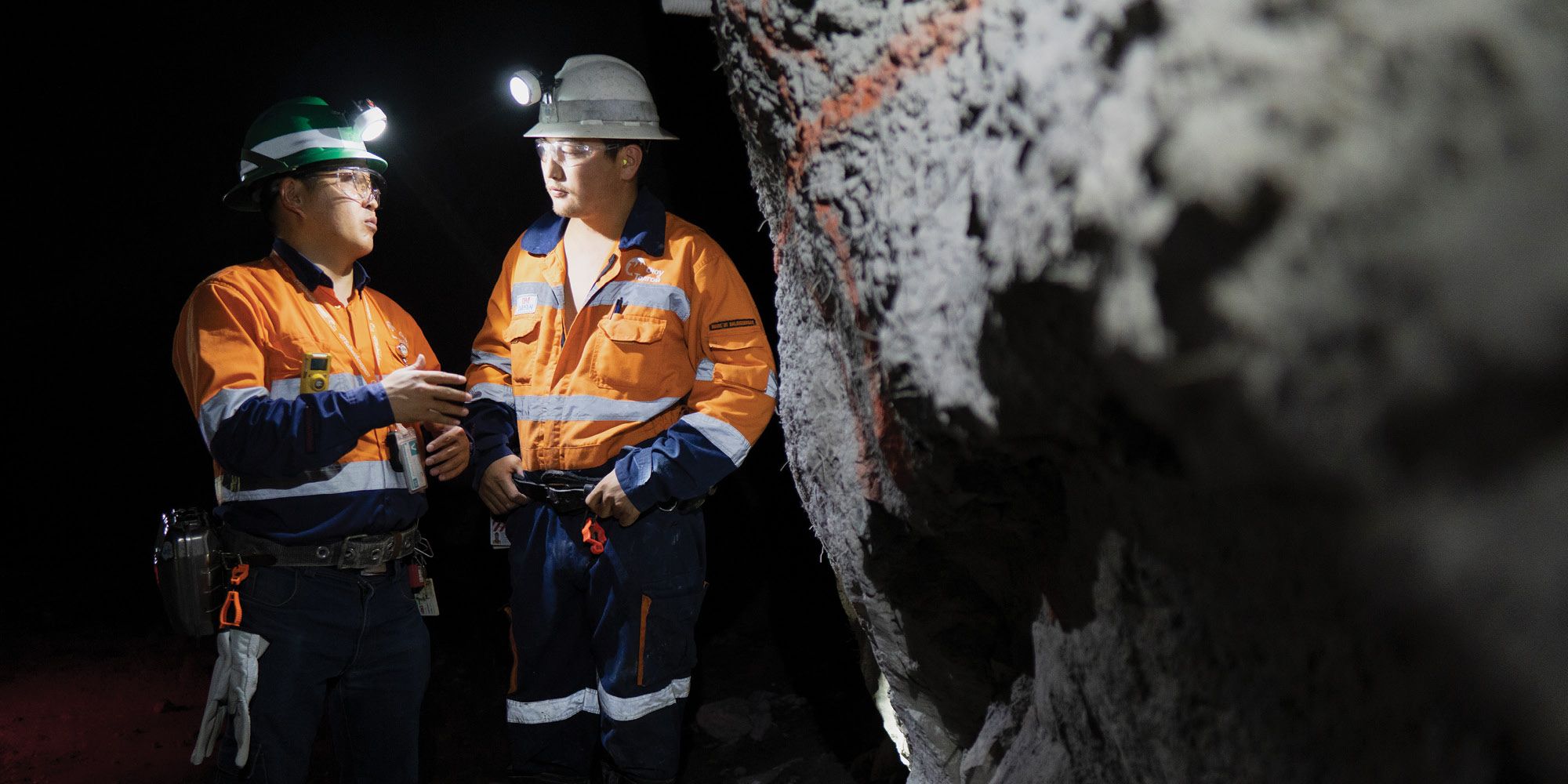Two people talking underground