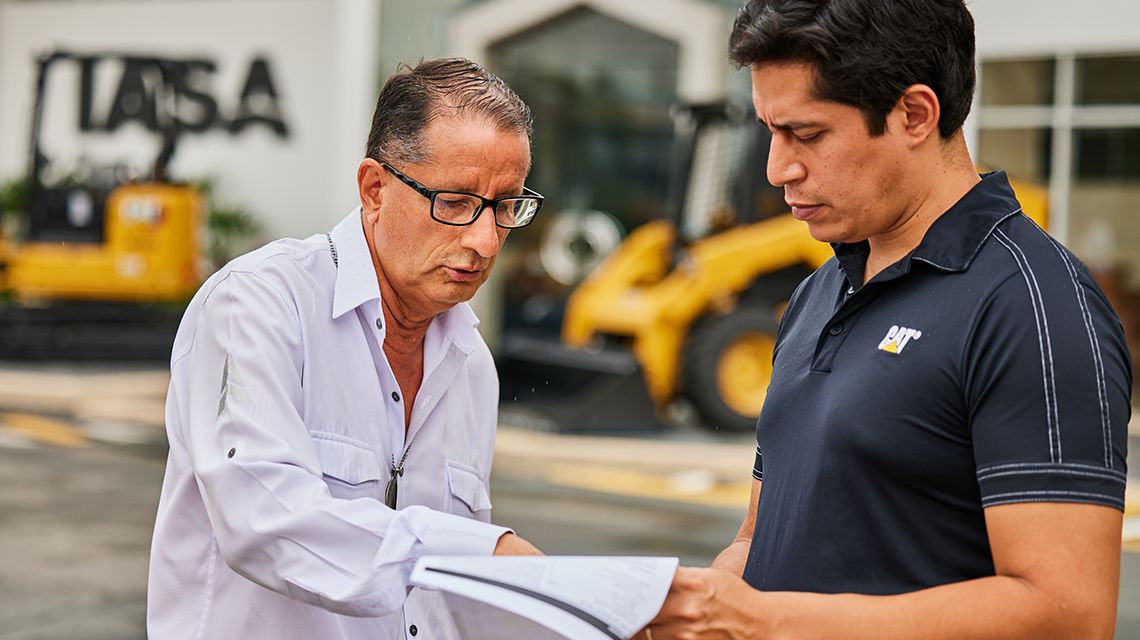two people reviewing some paperwork