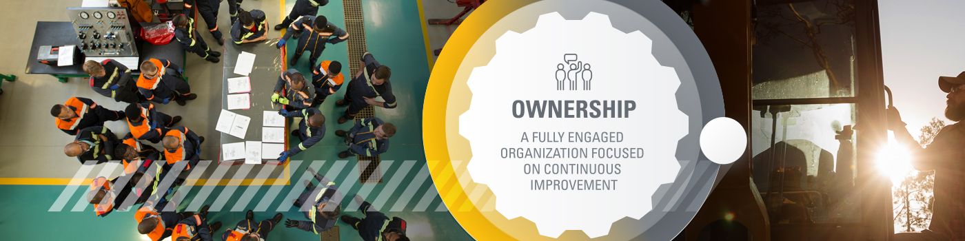 Three people walking on a job site