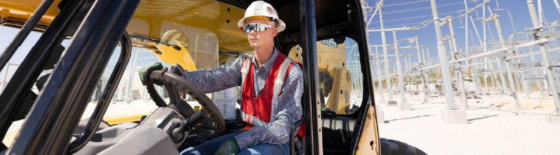 Man driving telehandler