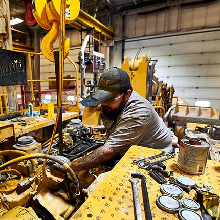 dealer talking to customer about Cat machine rebuild cost