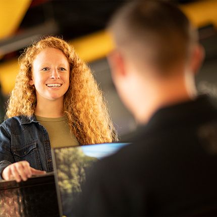 Customer smiling at Cat dealer