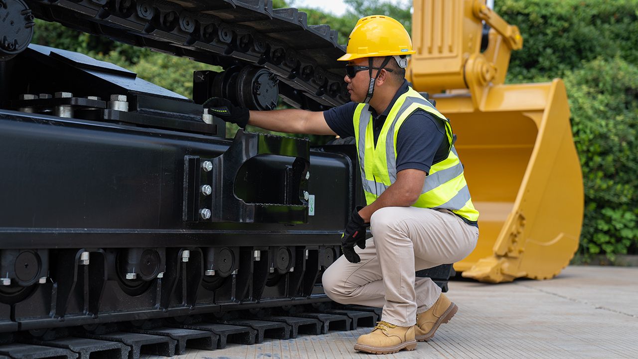Man inspecting machine