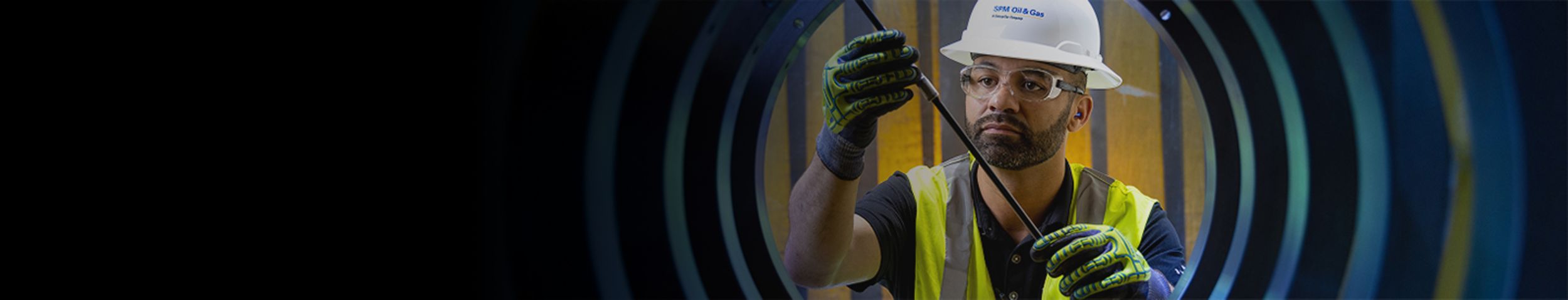 SPM employee working on a well service pump