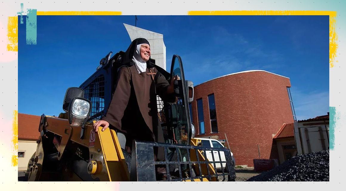 A nun sitting on their Cat skid steer loader