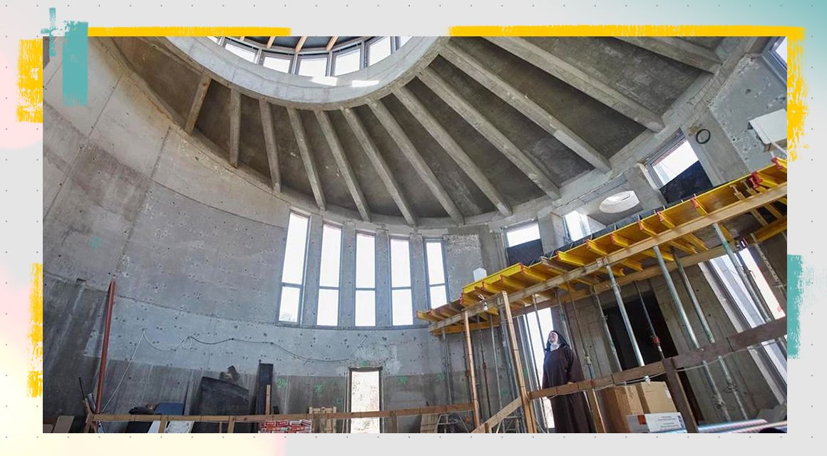 Nun standing in a structure that's under construction