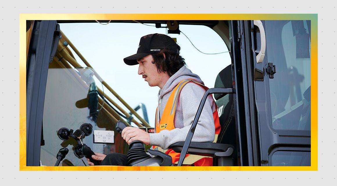 Man operating a Cat machine