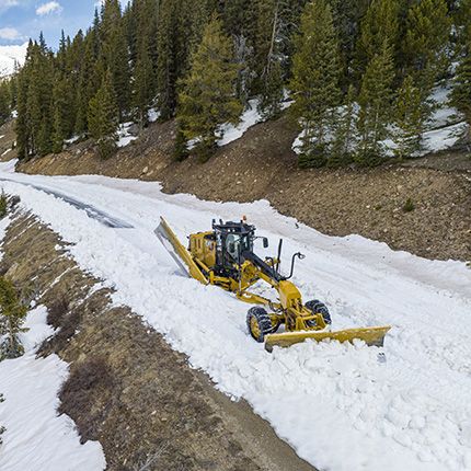 Machine plowing snow