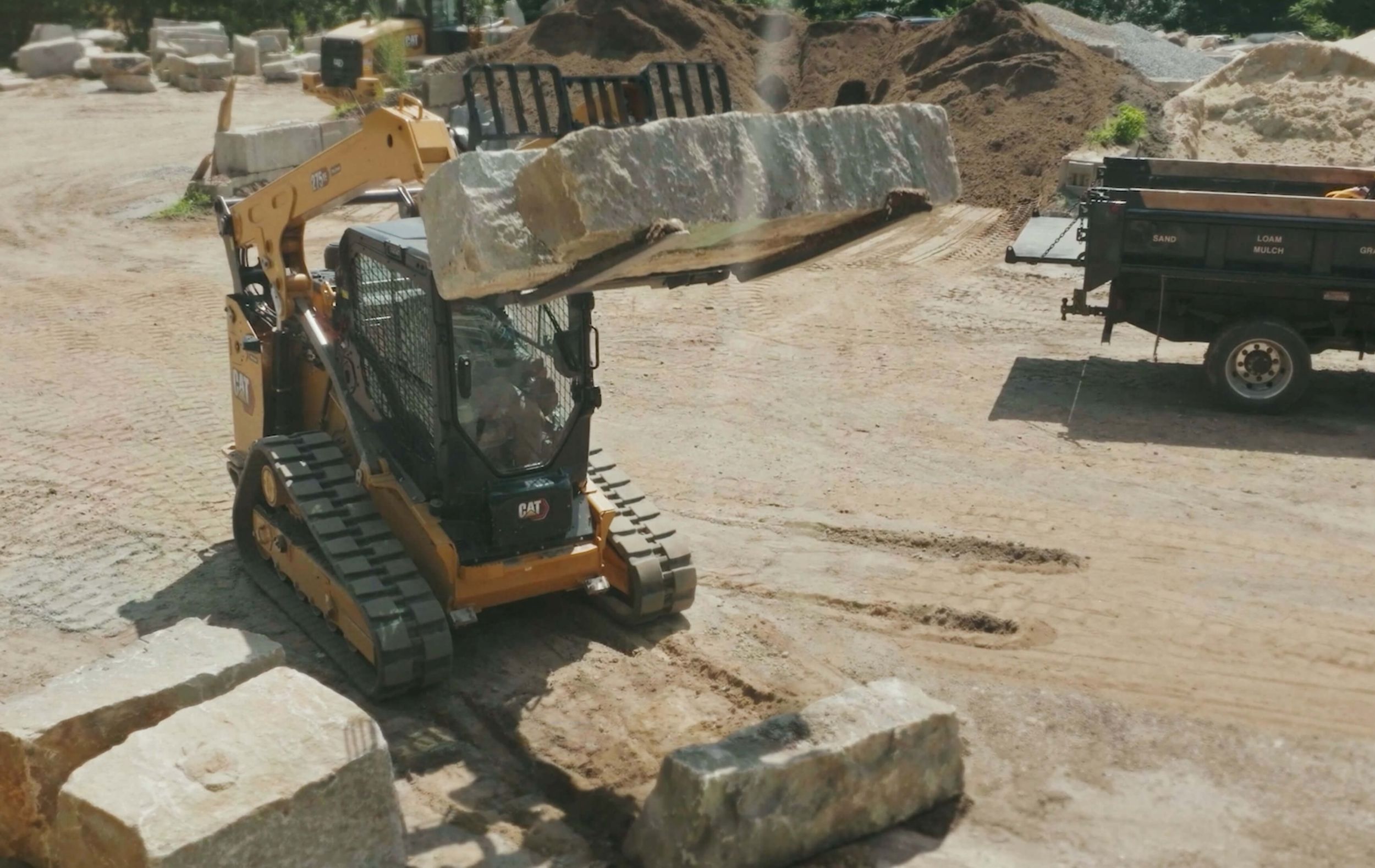 Skid steer lifting slab of concrete