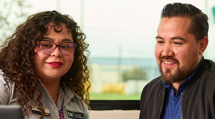 two people looking at a computer screen