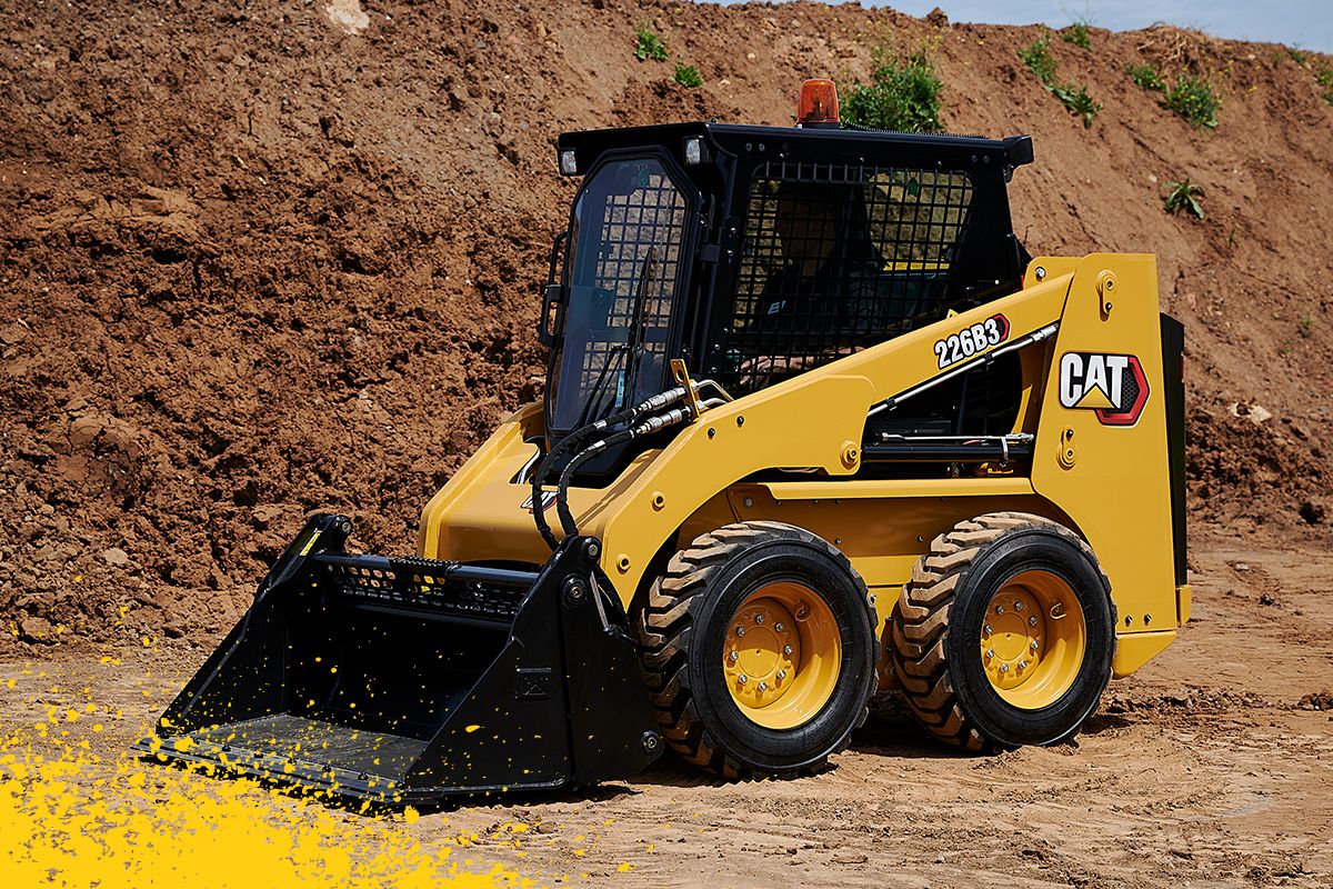 226B3 moviendo arena en cubo