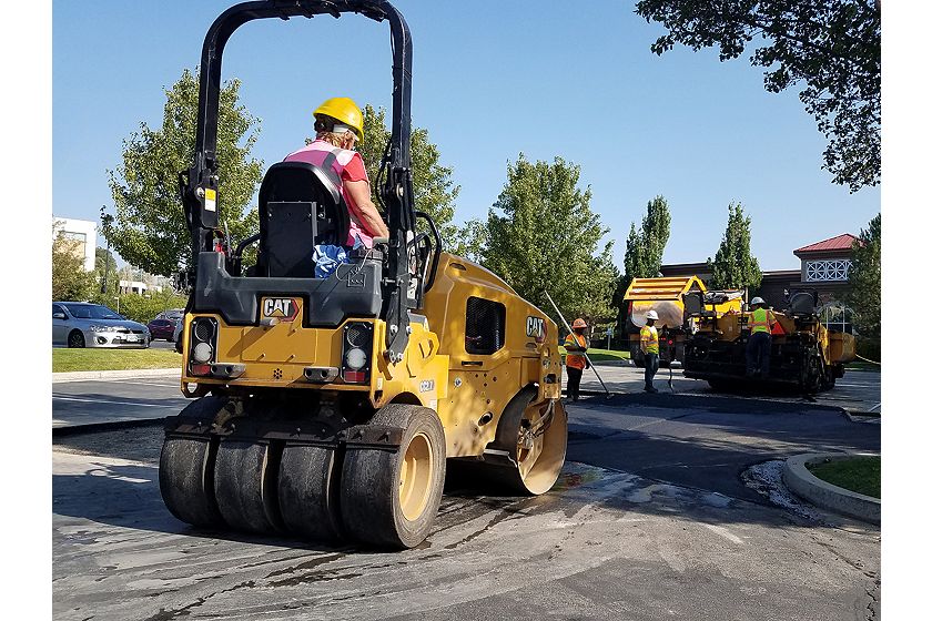CC2.7 combination tandem roller compacting asphalt in a parking lot.