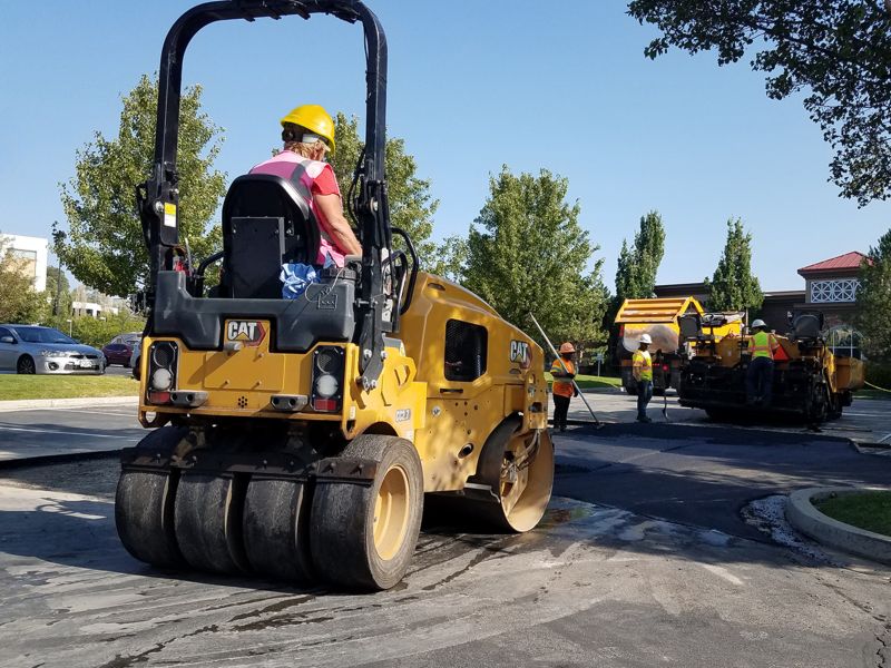 CC2.7 combination tandem roller compacting asphalt in a parking lot.