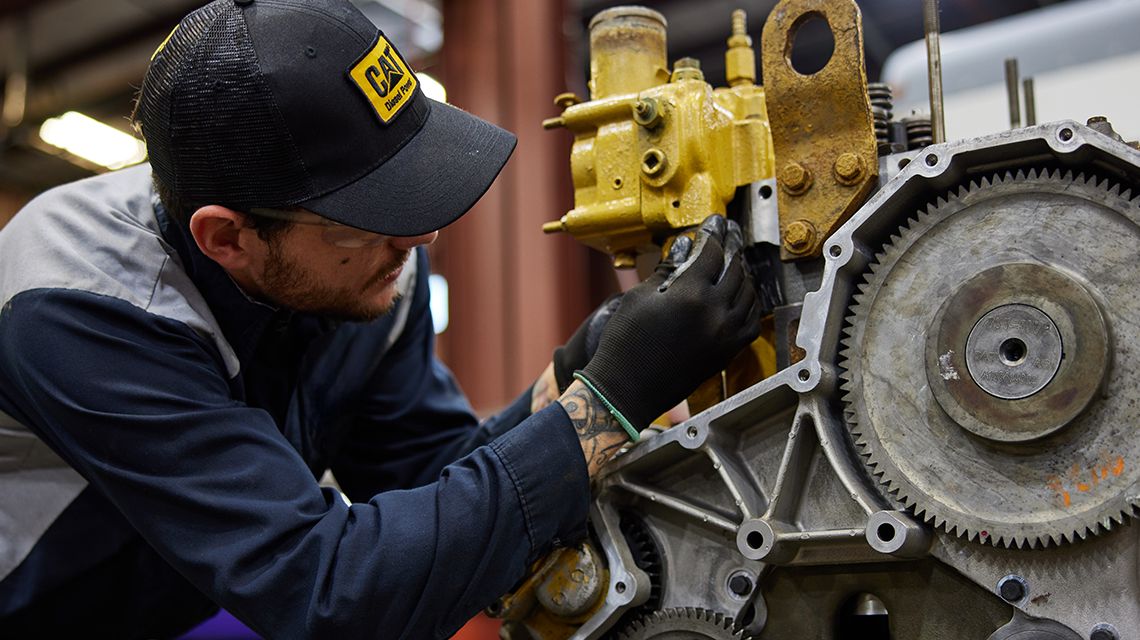 technician working on an engine