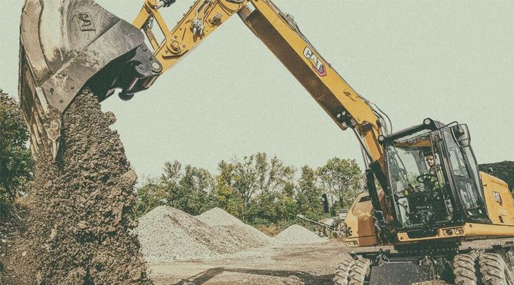 Wheeled excavator working shot in Stay True look