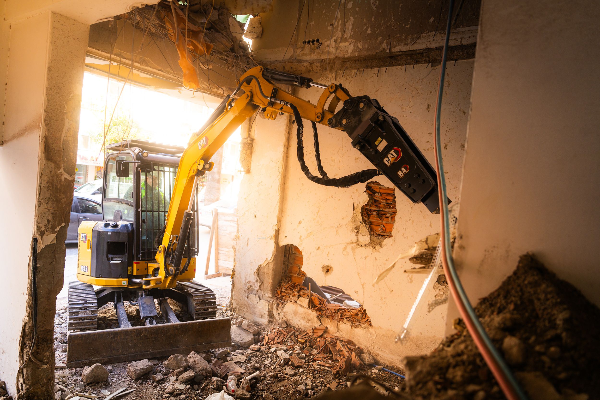 Mini excavator demolition on small structure