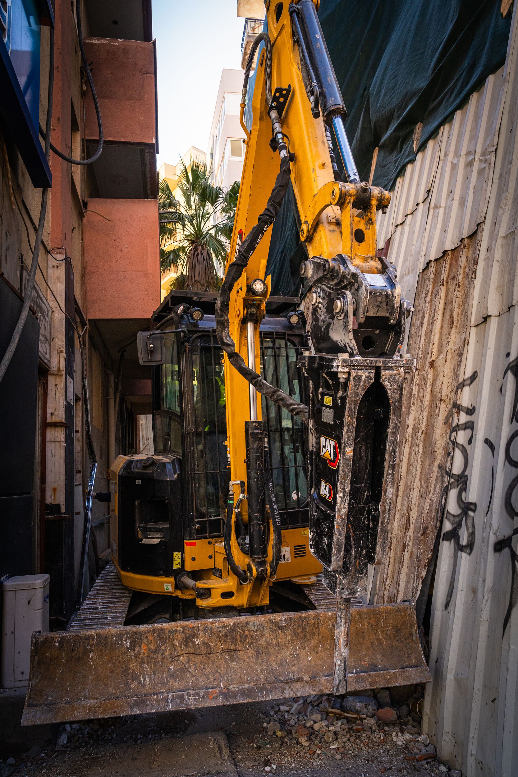Mini excavator in a small alleyway