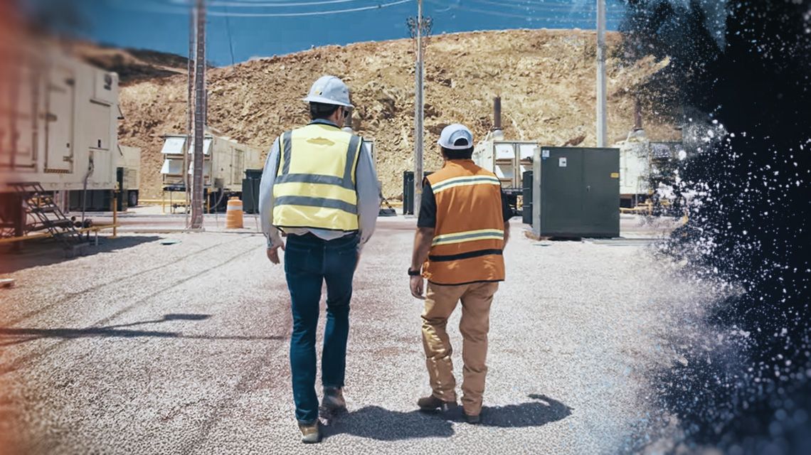 Two Men Walking on a Job Site