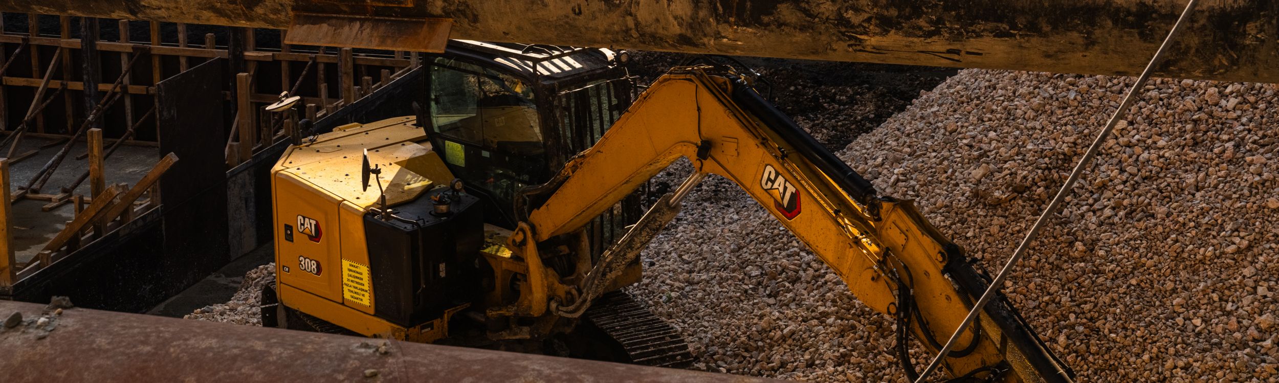 Mini excavator parked on a hill