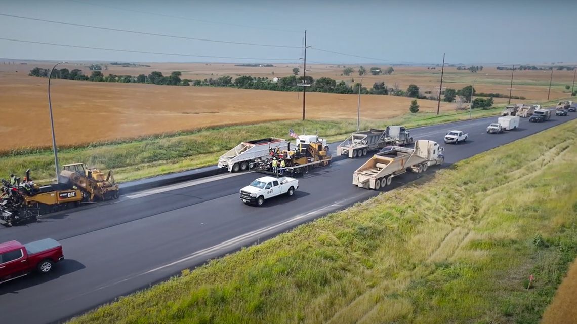 Paving machine working on a road