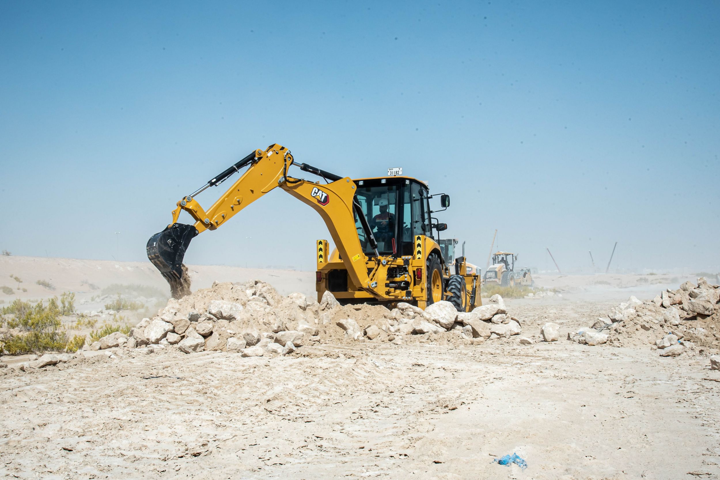 Backhoe Loader working in dry rocky area