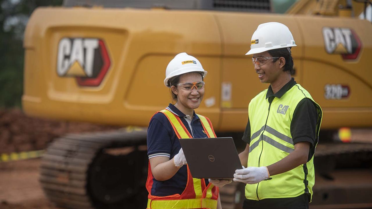 Construction workers viewing tablet