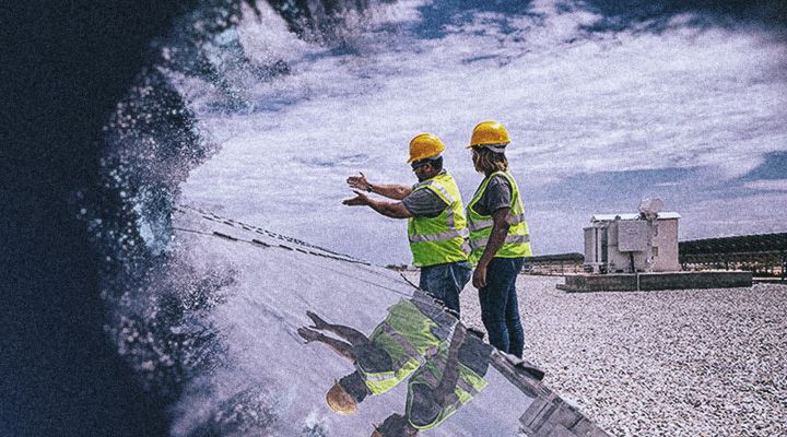 Two people talking on an Electric Power Job Site